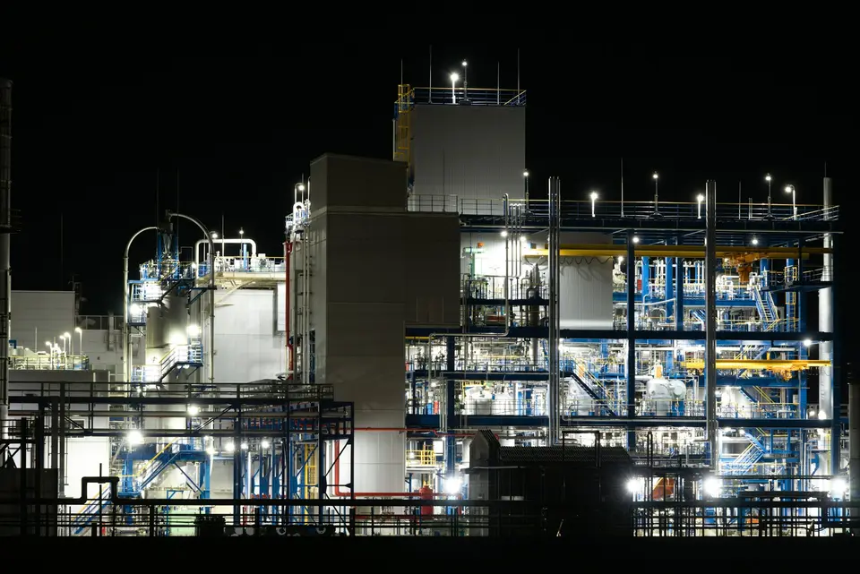 Industrial processing plant illuminated at night